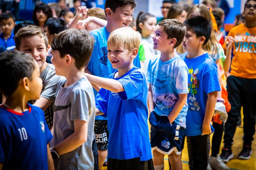 Students and families participate in a fun run